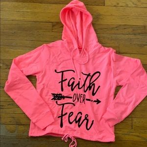 A bright pink hoodie